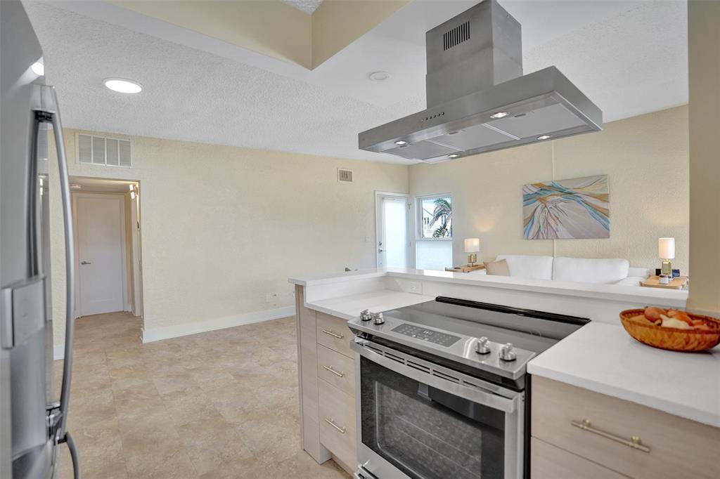 5700 Old Ocean Boulevard, Unit X Ocean Ridge, FL 33435 - Photo 17 of 49 a stove top oven sitting inside of a kitchen