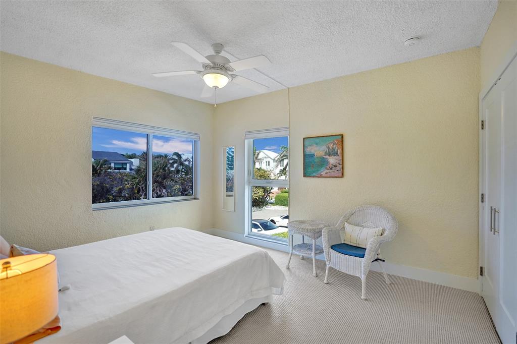 5700 Old Ocean Boulevard, Unit X Ocean Ridge, FL 33435 - Photo 19 of 49 a bedroom with a bed and a window