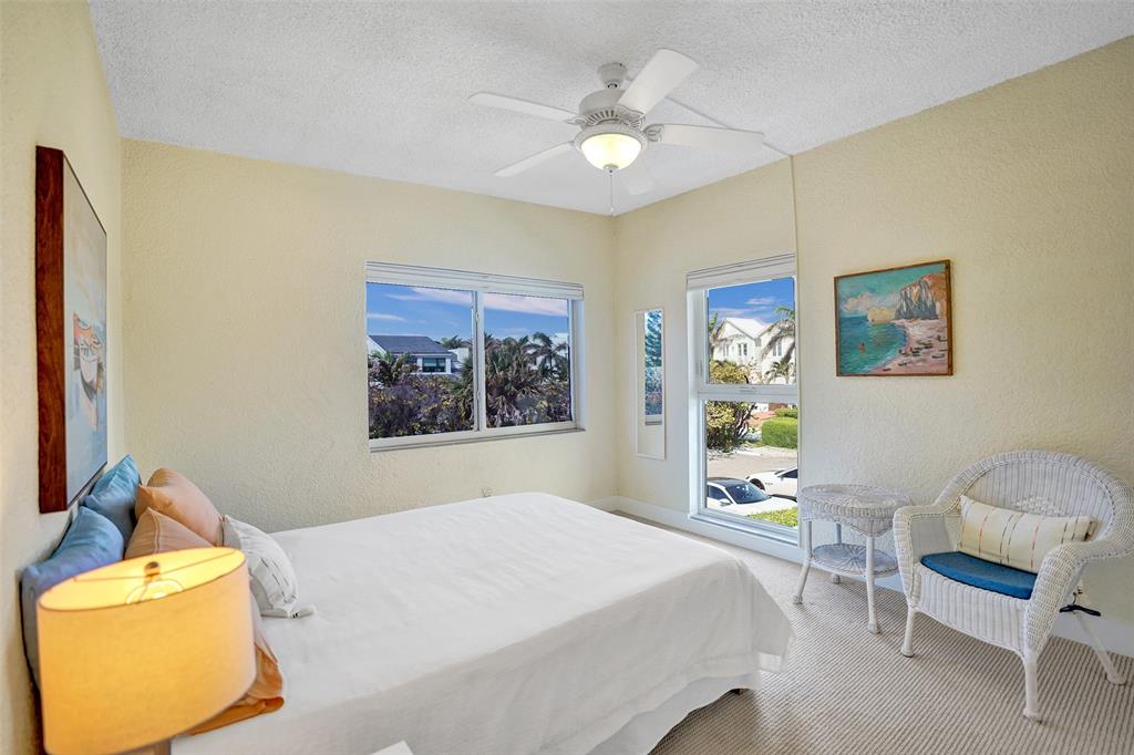 5700 Old Ocean Boulevard, Unit X Ocean Ridge, FL 33435 - Photo 20 of 49 a bedroom with a bed and window