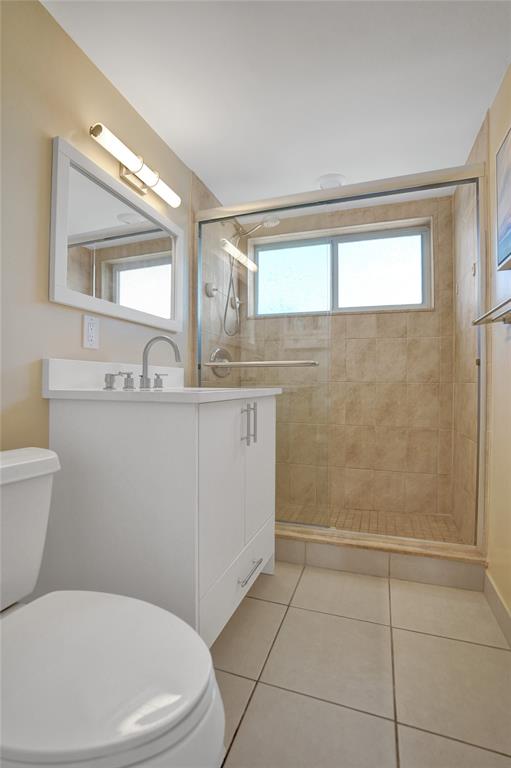 5700 Old Ocean Boulevard, Unit X Ocean Ridge, FL 33435 - Photo 23 of 49 a bathroom with a toilet a sink a mirror and a shower