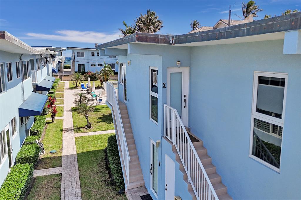5700 Old Ocean Boulevard, Unit X Ocean Ridge, FL 33435 - Photo 25 of 49 a view of a house with a swimming pool