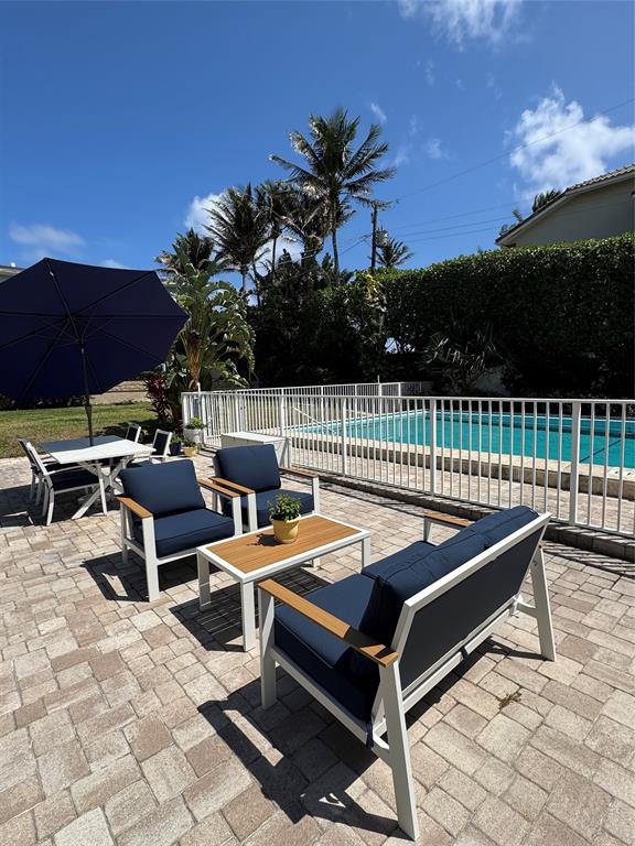 5700 Old Ocean Boulevard, Unit X Ocean Ridge, FL 33435 - Photo 35 of 49 a view of a terrace with furniture