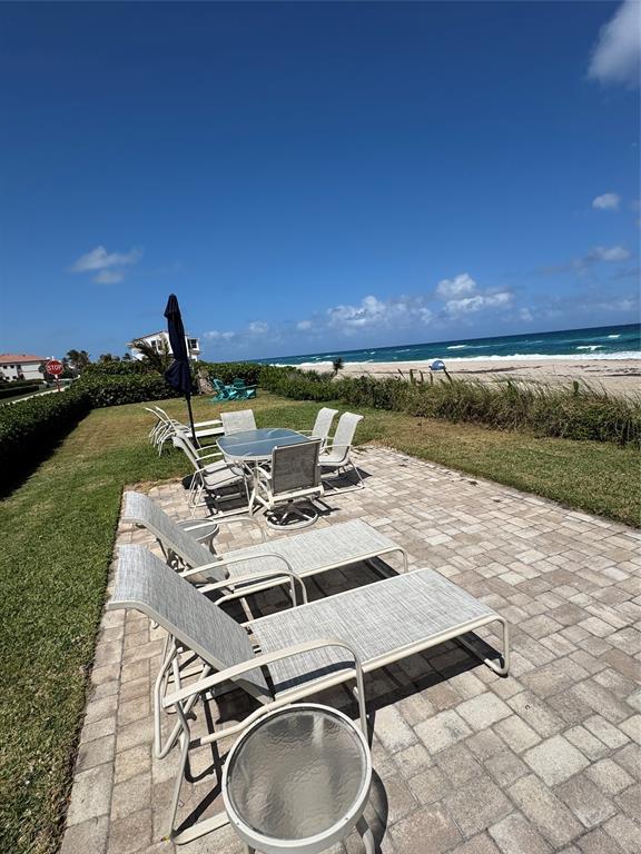 5700 Old Ocean Boulevard, Unit X Ocean Ridge, FL 33435 - Photo 40 of 49 a patio with water view and a ocean view