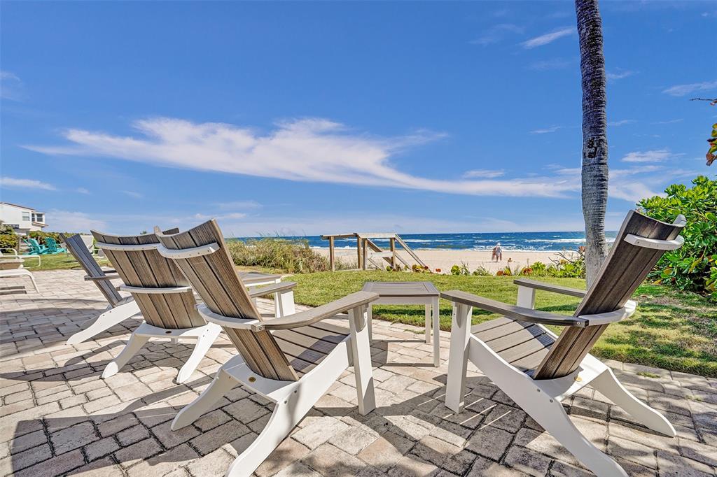 5700 Old Ocean Boulevard, Unit X Ocean Ridge, FL 33435 - Photo 41 of 49 a view of a chairs and table on the terrace