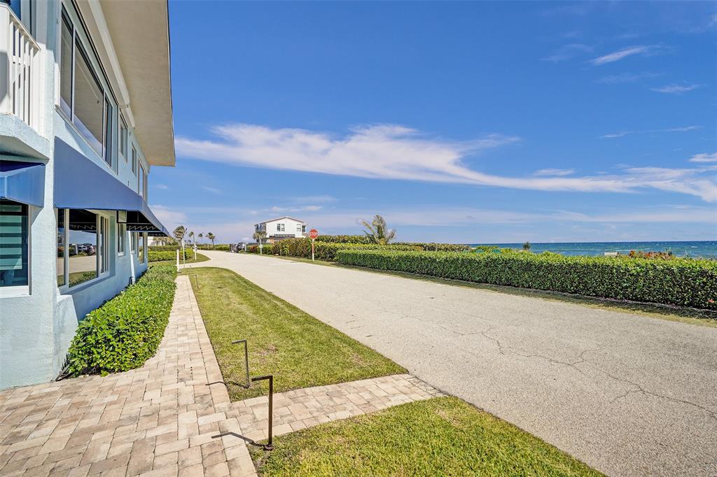 5700 Old Ocean Boulevard, Unit X Ocean Ridge, FL 33435 - Photo 47 of 49 a view of swimming pool with a yard