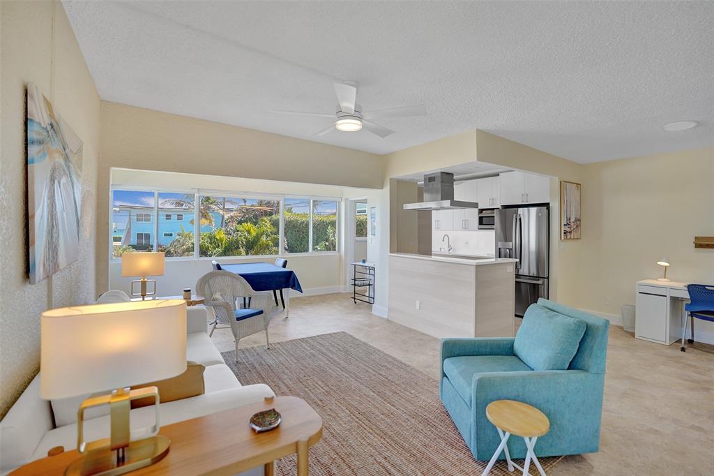 5700 Old Ocean Boulevard, Unit X Ocean Ridge, FL 33435 - Photo 5 of 49 a living room with furniture and a large window