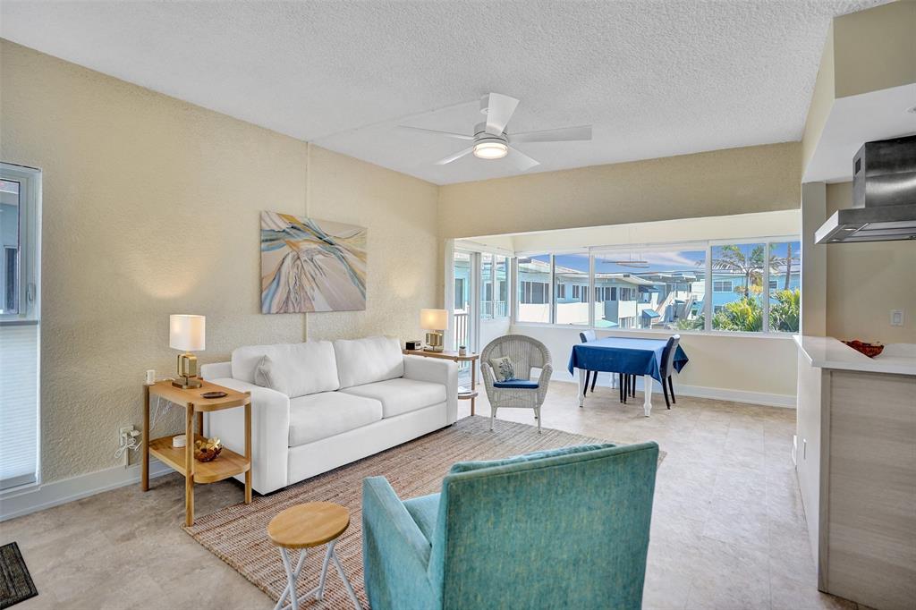 5700 Old Ocean Boulevard, Unit X Ocean Ridge, FL 33435 - Photo 6 of 49 a living room with furniture a chandelier and a dining table