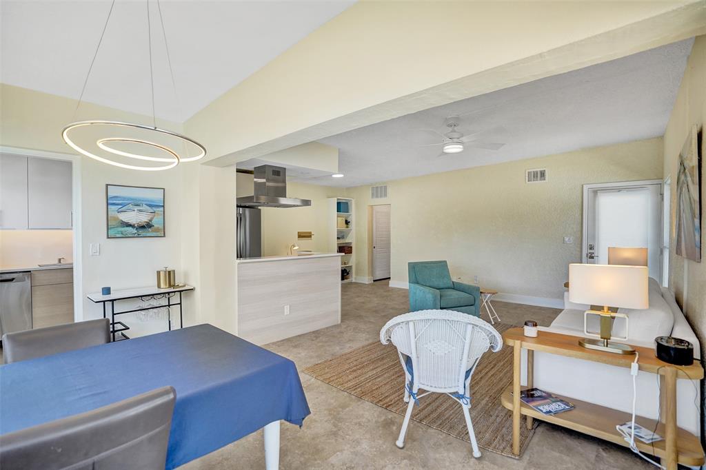 5700 Old Ocean Boulevard, Unit X Ocean Ridge, FL 33435 - Photo 7 of 49 a living room with furniture and a table