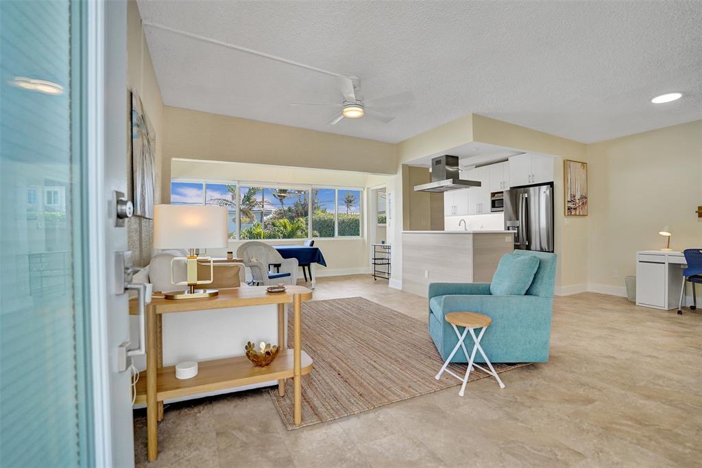 5700 Old Ocean Boulevard, Unit X Ocean Ridge, FL 33435 - Photo 9 of 49 a living room with furniture and a large window