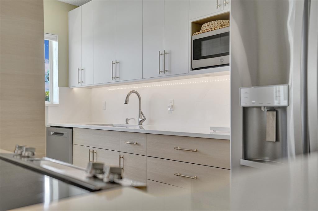 5700 Old Ocean Boulevard, Unit X Ocean Ridge, FL 33435 - Photo 10 of 49 a kitchen with a sink and cabinets