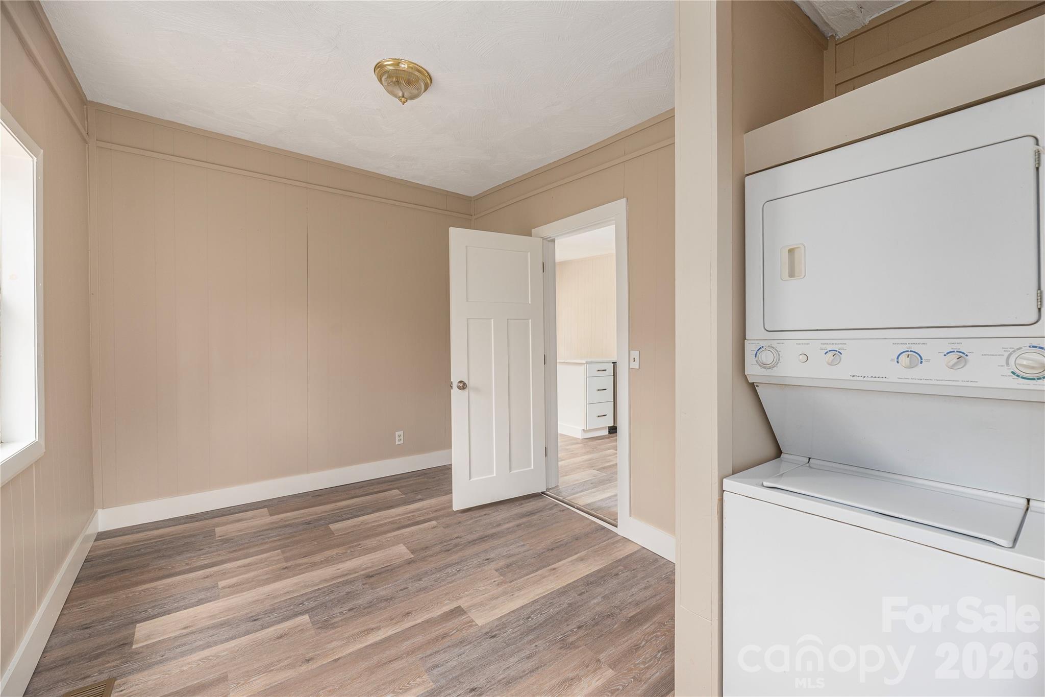 448 Sand Hill Road Asheville, NC 28806 - Photo 11 of 24 a view of washer and dryer with bathroom in the background