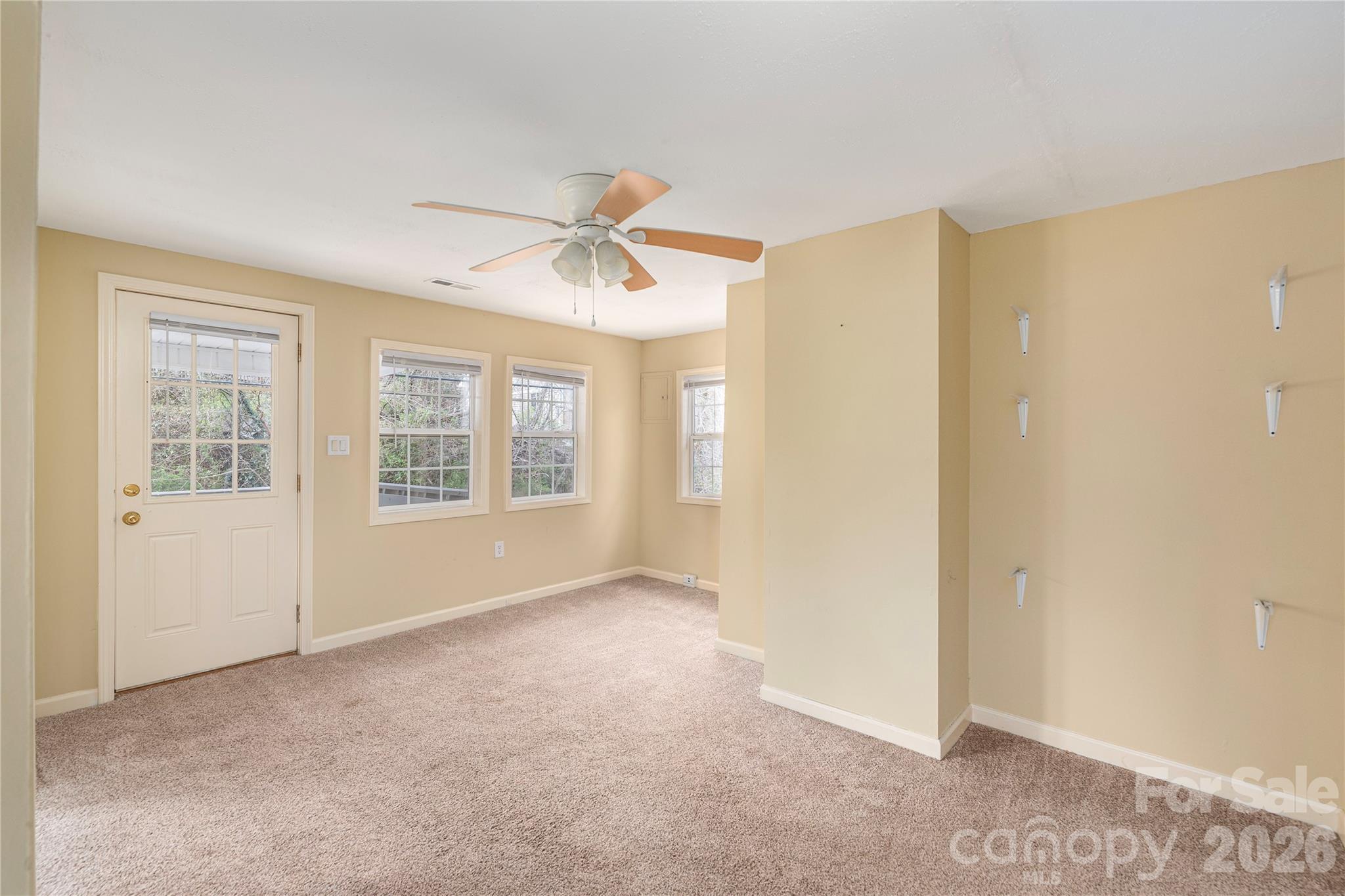 448 Sand Hill Road Asheville, NC 28806 - Photo 14 of 24 a view of an empty room with a window
