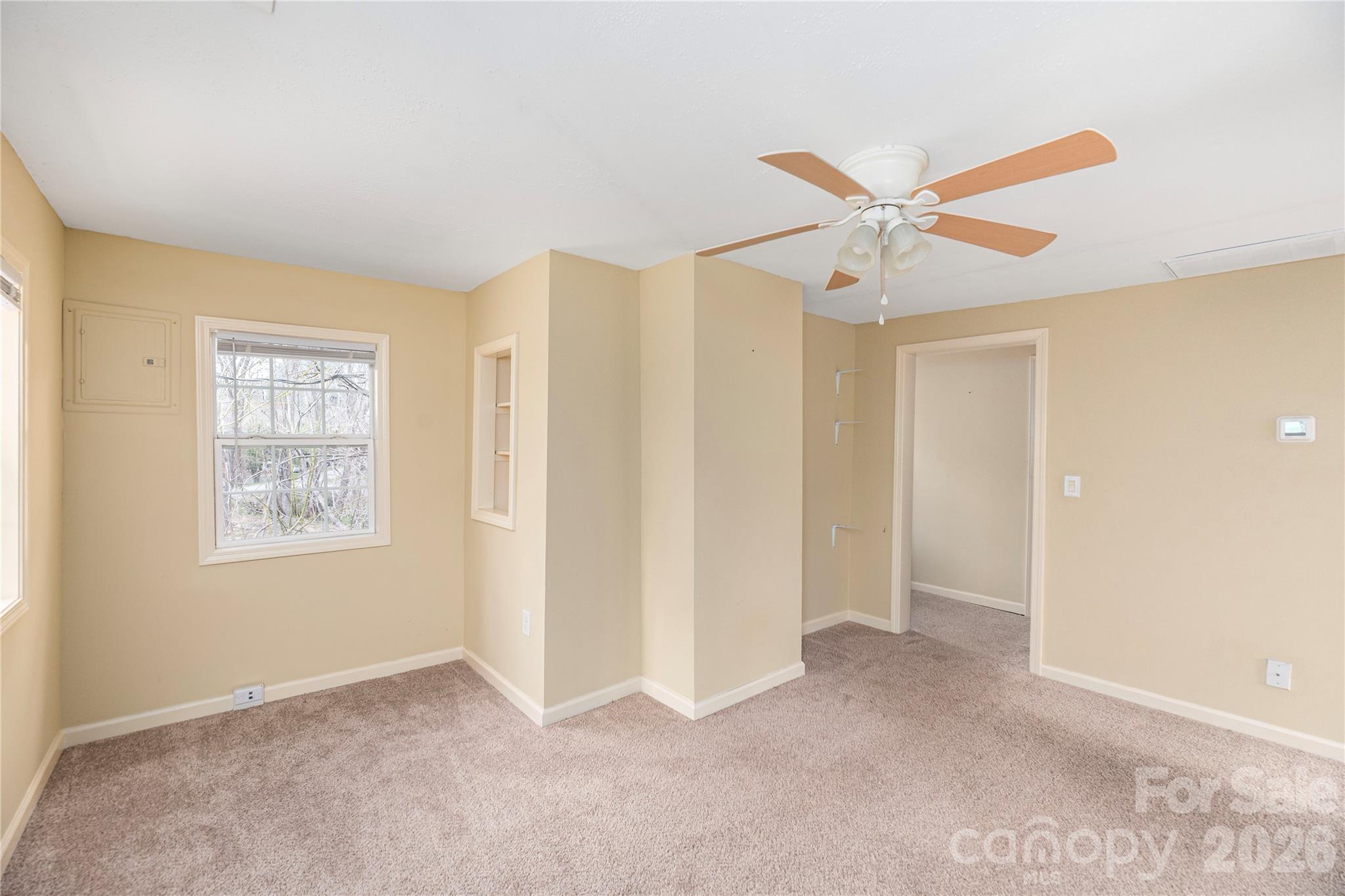 448 Sand Hill Road Asheville, NC 28806 - Photo 15 of 24 a view of an empty room with a window
