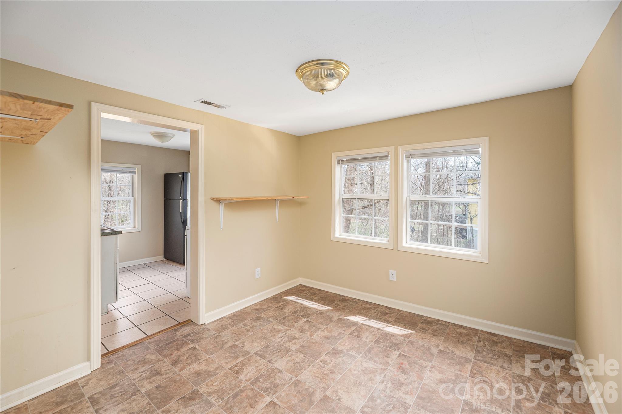 448 Sand Hill Road Asheville, NC 28806 - Photo 17 of 24 a view of an empty room and window