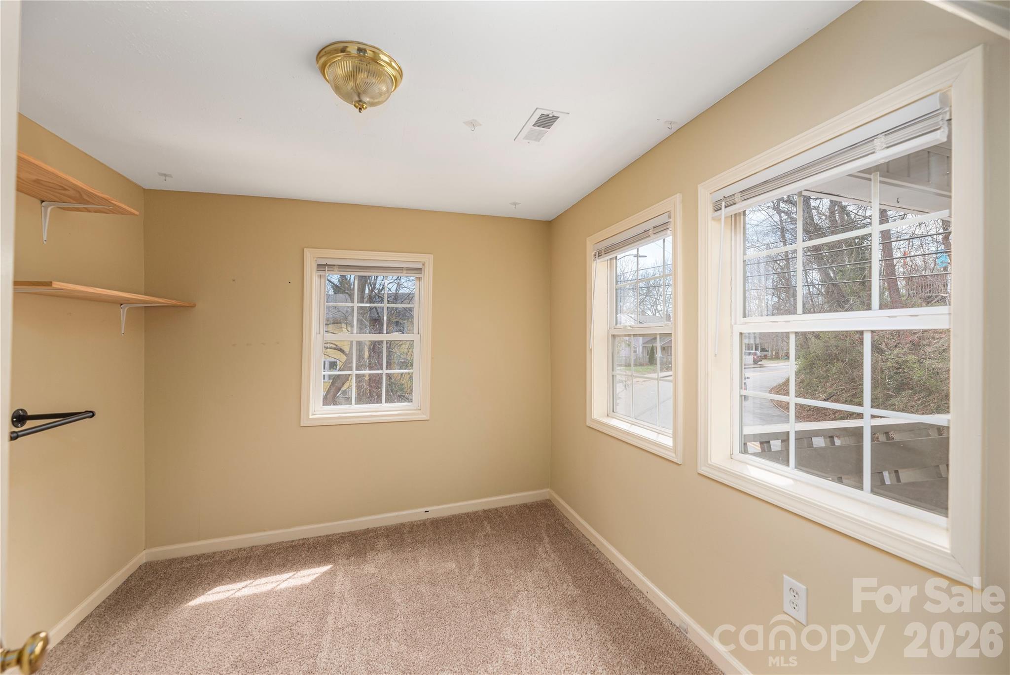 448 Sand Hill Road Asheville, NC 28806 - Photo 20 of 24 a view of an empty room with a window