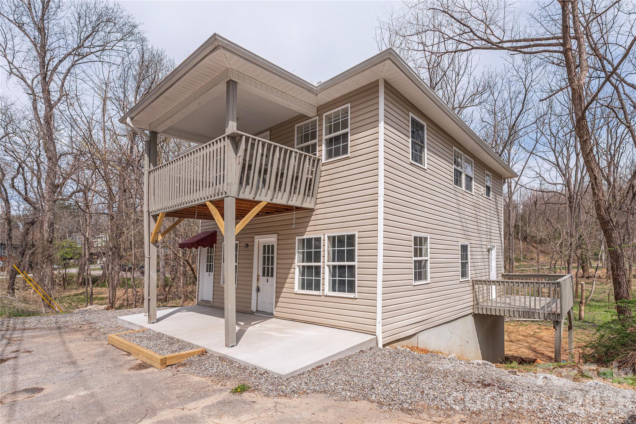448 Sand Hill Road Asheville, NC 28806 - Photo 2 of 24 a front view of a house with garden