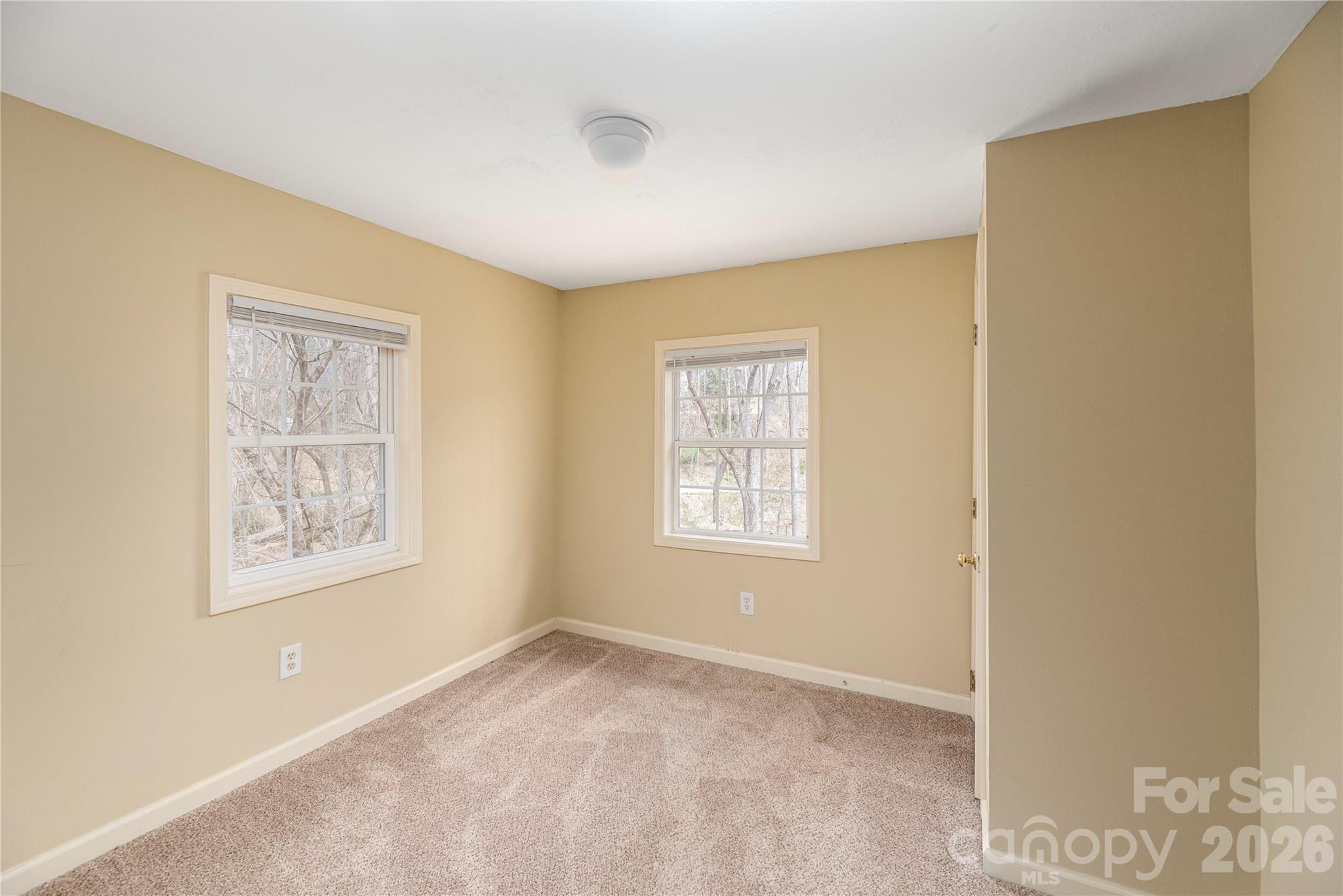 448 Sand Hill Road Asheville, NC 28806 - Photo 22 of 24 a view of an empty room with a window