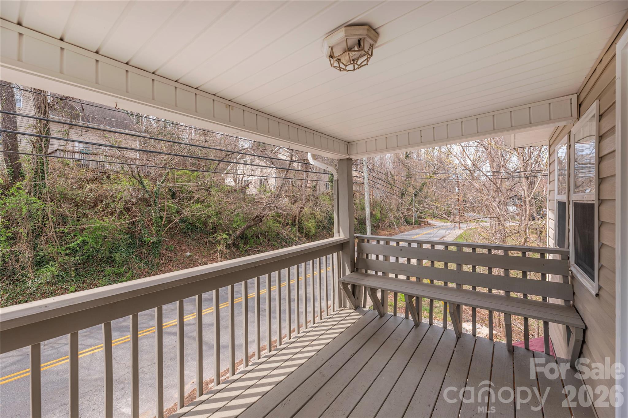 448 Sand Hill Road Asheville, NC 28806 - Photo 23 of 24 a view of a porch with wooden floor