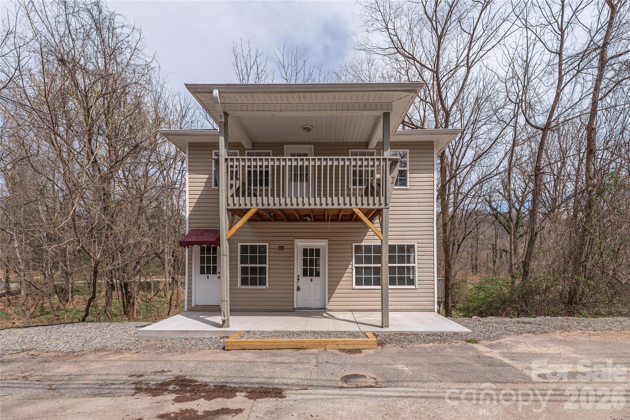 448 Sand Hill Road Asheville, NC 28806 - Photo 3 of 24 a front view of a house with a garden