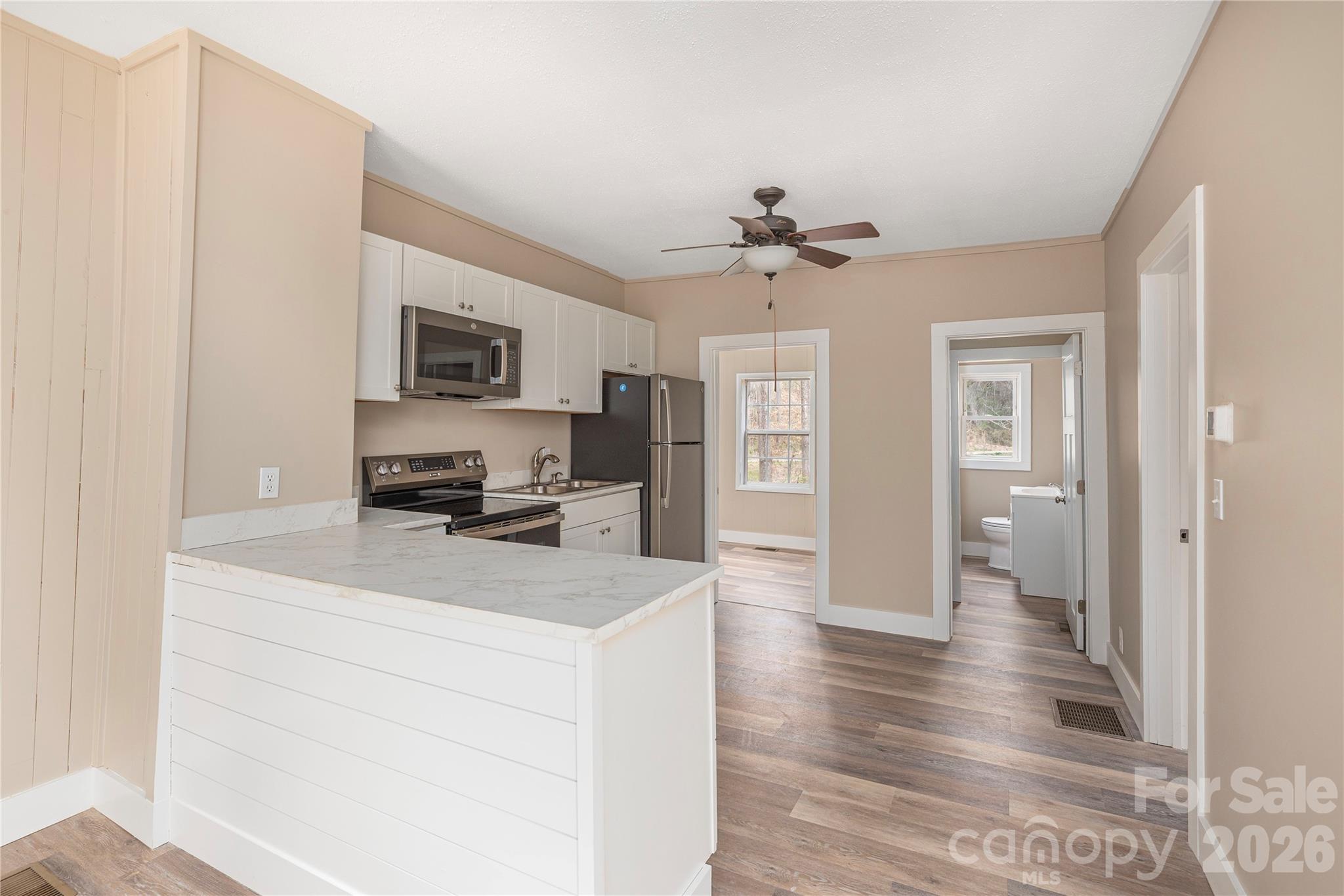 448 Sand Hill Road Asheville, NC 28806 - Photo 6 of 24 a view of living room with granite countertop furniture and fireplace