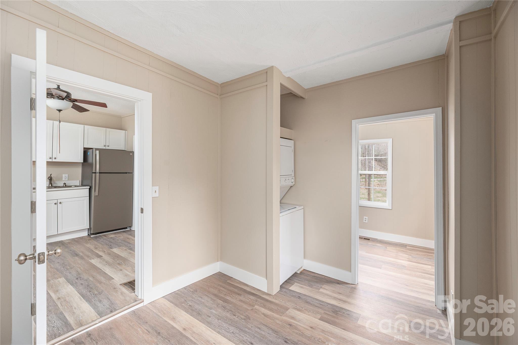 448 Sand Hill Road Asheville, NC 28806 - Photo 10 of 24 a view of a kitchen with wooden floor and a kitchen