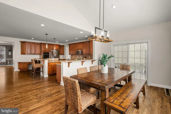 a kitchen with a table and chairs in it