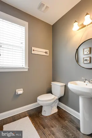 a bathroom with a toilet and a sink
