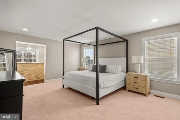 a bedroom with a bed and a cabinets