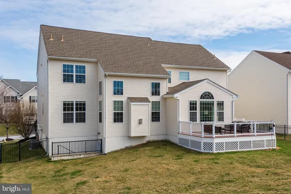 a view of a house with a swimming pool and windows