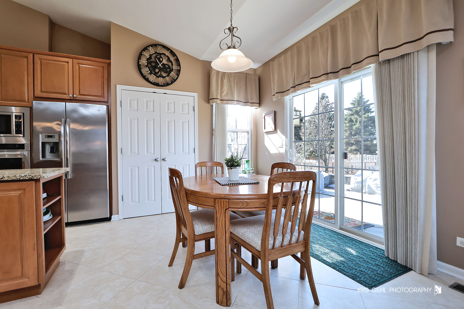 317 Sterling Circle Cary, IL 60013 - Photo 13 of 47 a dining room with furniture a chandelier and wooden floor