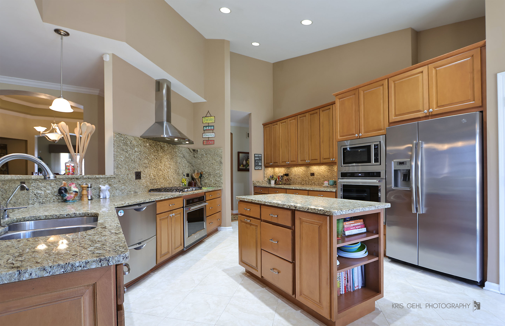 317 Sterling Circle Cary, IL 60013 - Photo 14 of 47 a kitchen with stainless steel appliances granite countertop a stove top oven a sink and a refrigerator