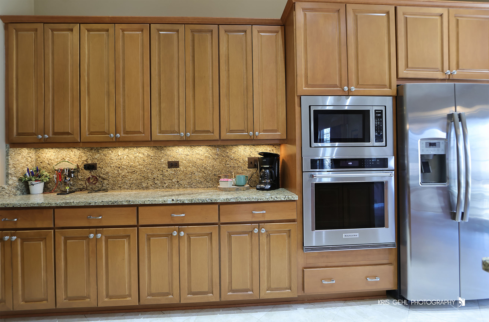 317 Sterling Circle Cary, IL 60013 - Photo 17 of 47 a kitchen with granite countertop a oven a fireplace and cabinets