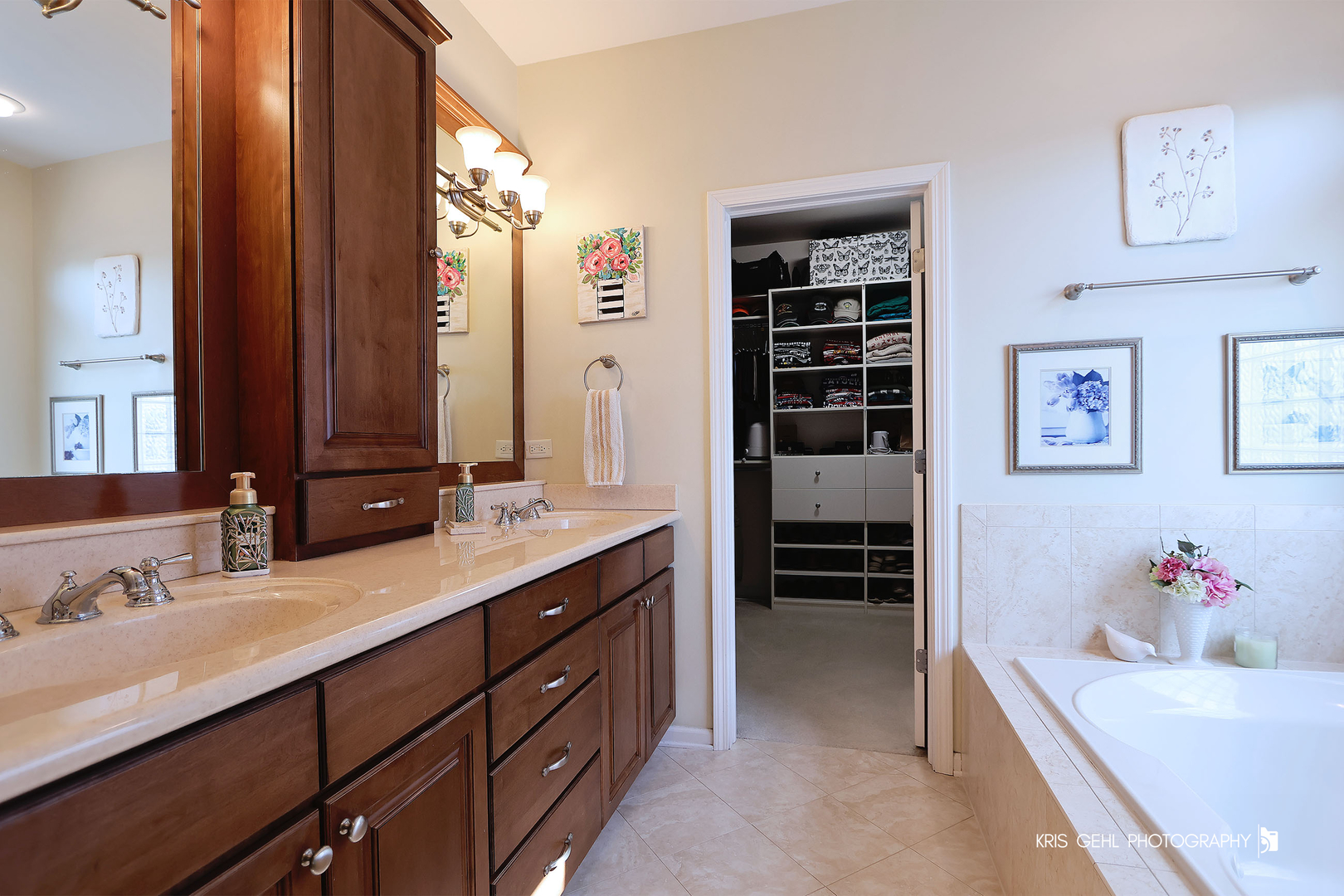 317 Sterling Circle Cary, IL 60013 - Photo 22 of 47 a spacious bathroom with a double vanity sink a large mirror and a shower