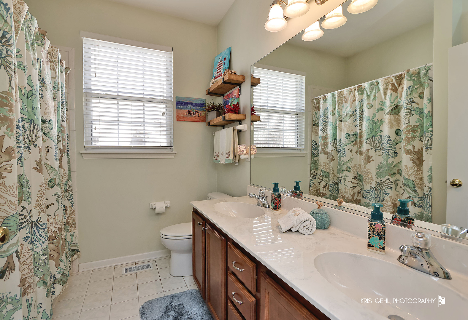 317 Sterling Circle Cary, IL 60013 - Photo 25 of 47 a bathroom with a double vanity sink toilet and a mirror