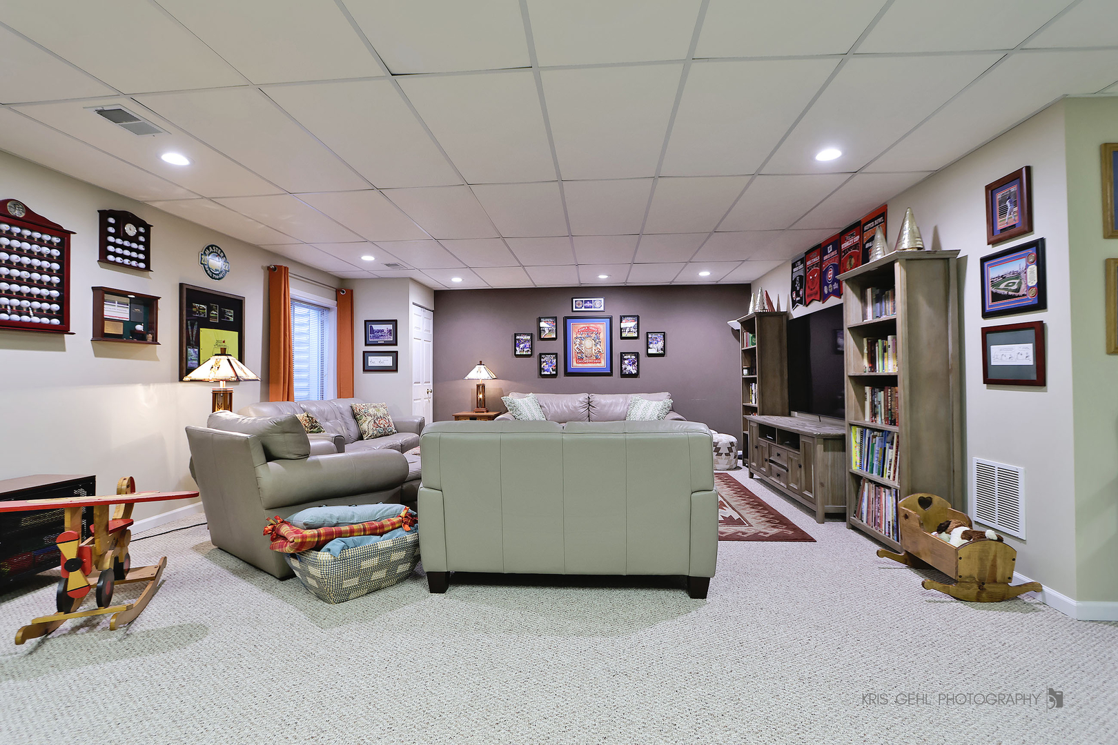 317 Sterling Circle Cary, IL 60013 - Photo 29 of 47 a living room with furniture gym equipment and a flat screen tv