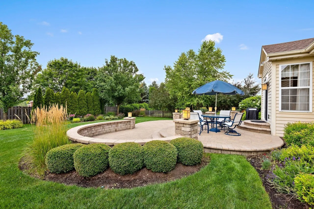 317 Sterling Circle Cary, IL 60013 - Photo 37 of 47 a view of pool with lawn chairs under an umbrella