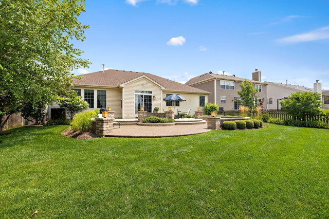 317 Sterling Circle Cary, IL 60013 - Photo 39 of 47 a view of a house with a patio and a yard