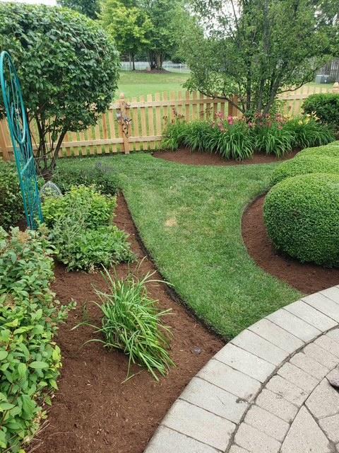 317 Sterling Circle Cary, IL 60013 - Photo 43 of 47 a view of a garden with a fountain