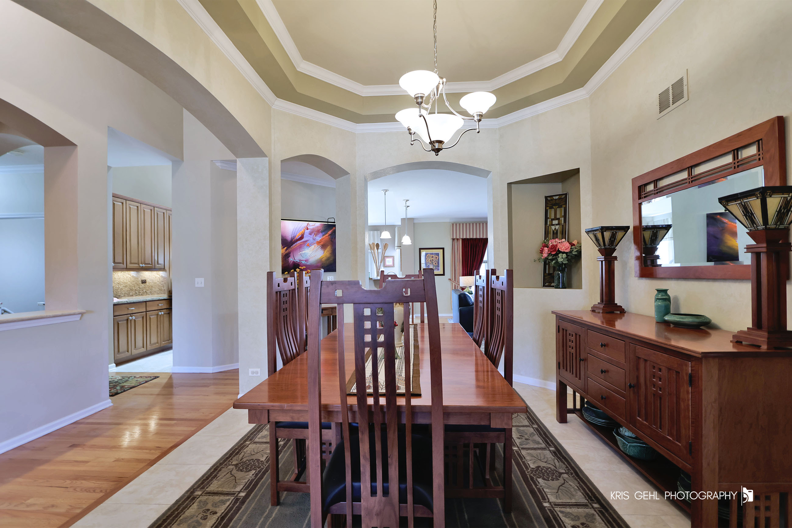 317 Sterling Circle Cary, IL 60013 - Photo 6 of 47 a view of a dining room with furniture a chandelier and wooden floor