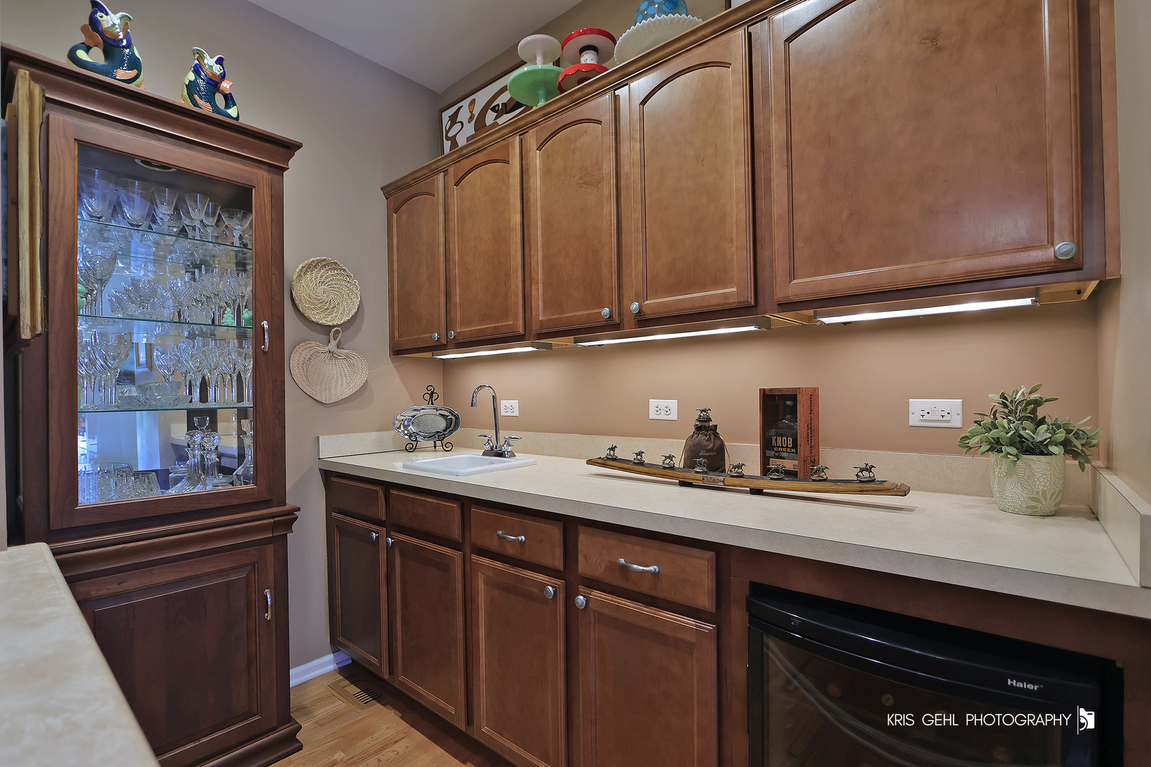 317 Sterling Circle Cary, IL 60013 - Photo 8 of 47 a kitchen with a sink and cabinets