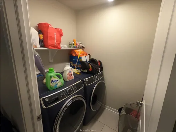 a picture of a bathroom with a shower