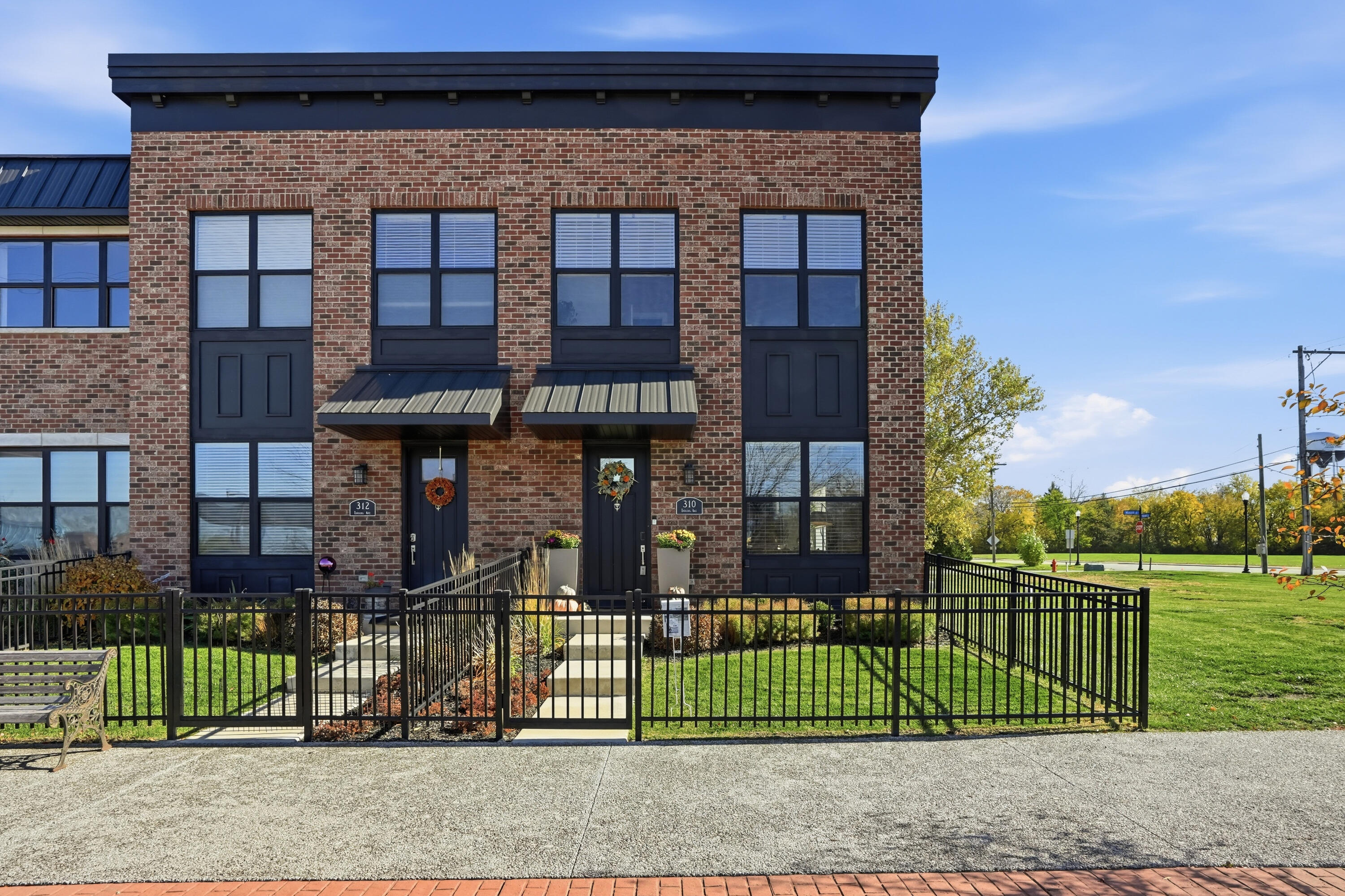 front view of a house with a fence