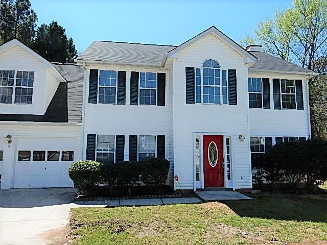 3011 River Oak Mews Decatur, GA 30034 - Photo 1 of 1 a front view of a house with garden