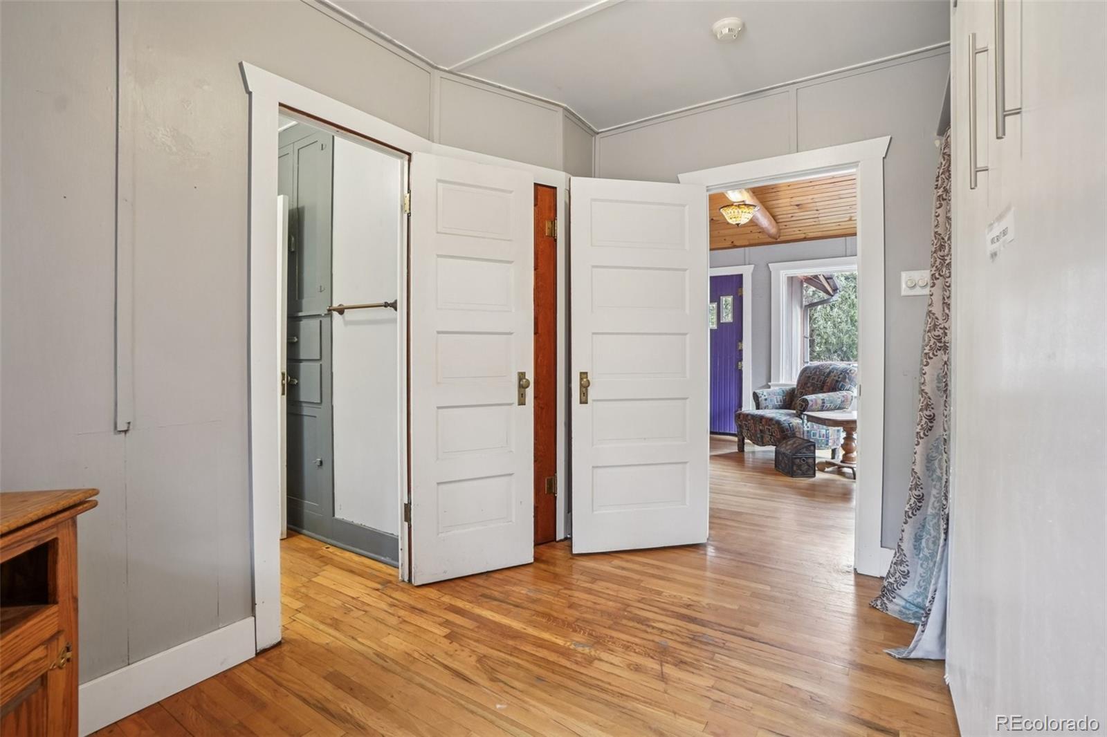 9025 Picabo Road Cascade, CO 80809 - Photo 16 of 44 a view of livingroom with furniture and wooden floor