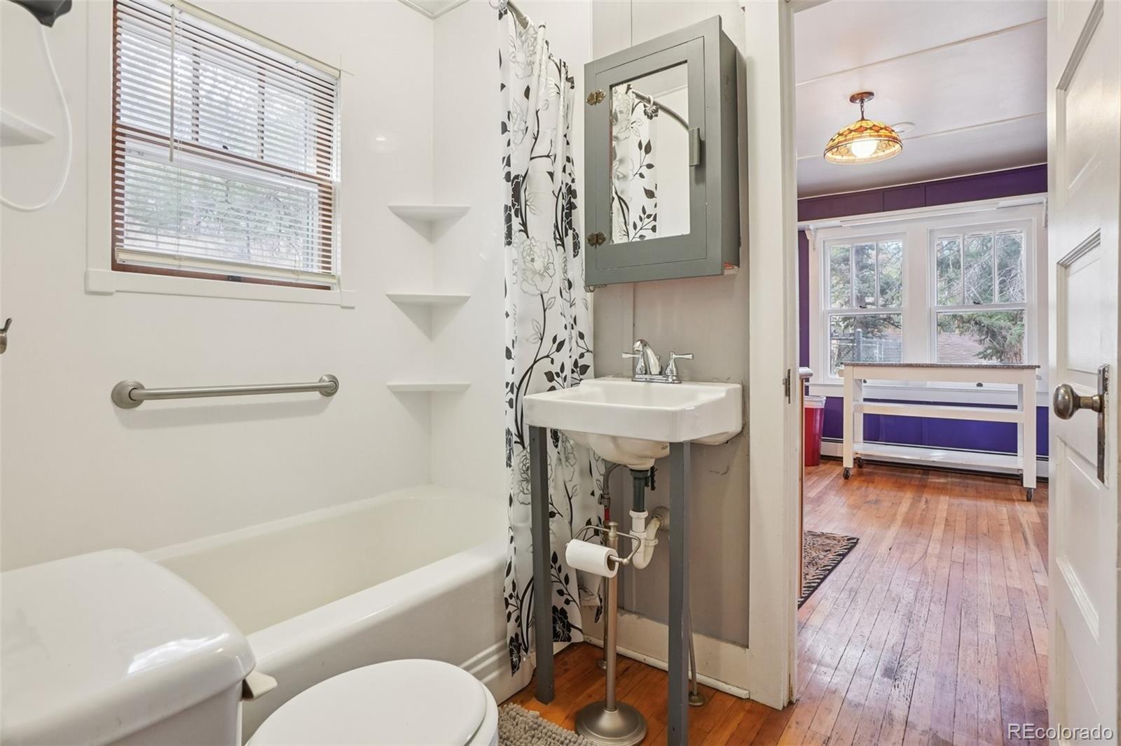 9025 Picabo Road Cascade, CO 80809 - Photo 18 of 44 a bathroom with a sink a toilet and a bathtub