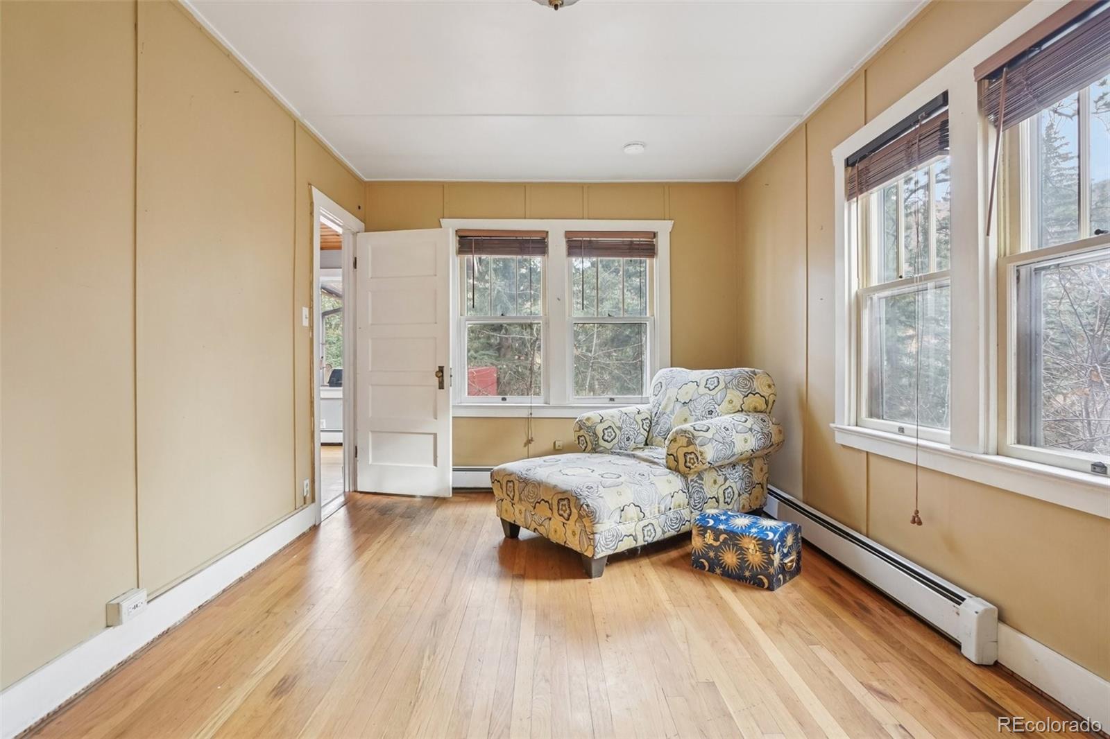9025 Picabo Road Cascade, CO 80809 - Photo 19 of 44 a bedroom with a bed and a window