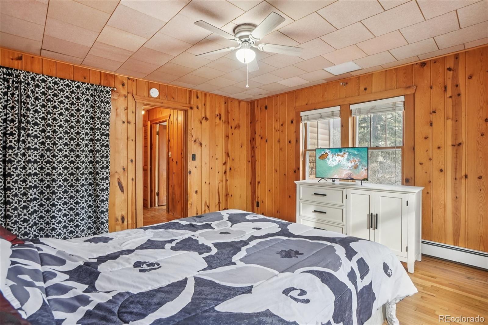 9025 Picabo Road Cascade, CO 80809 - Photo 23 of 44 a bedroom with a bed and a window