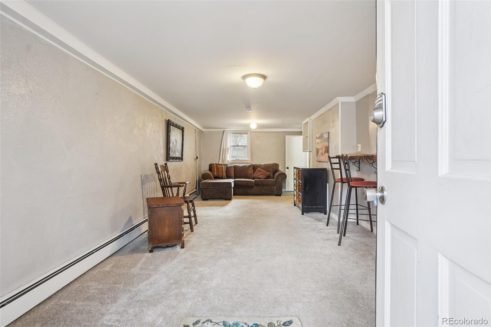 9025 Picabo Road Cascade, CO 80809 - Photo 28 of 44 a view of a livingroom with furniture and a window