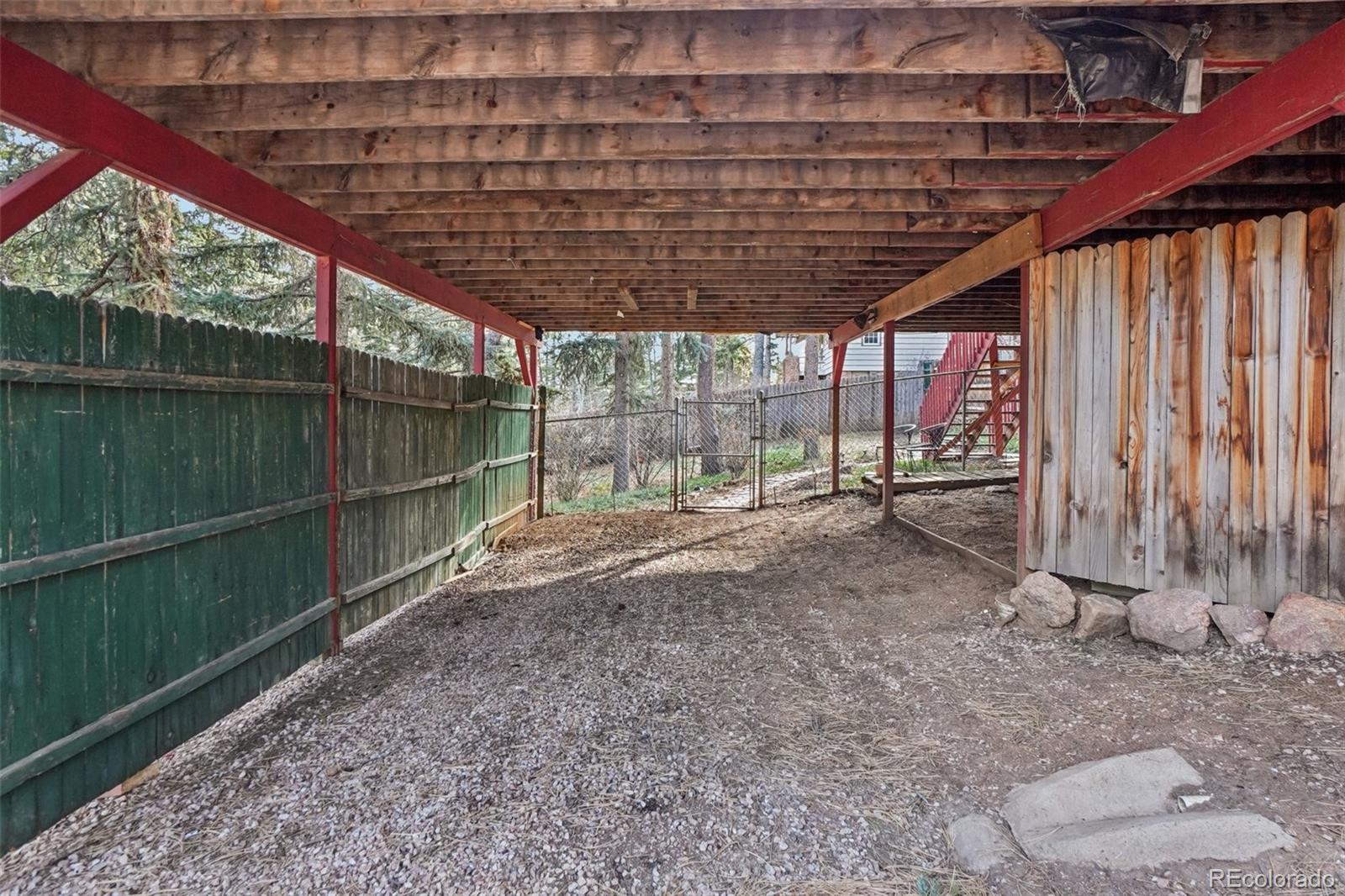 9025 Picabo Road Cascade, CO 80809 - Photo 41 of 44 a view of outdoor space with wooden fence