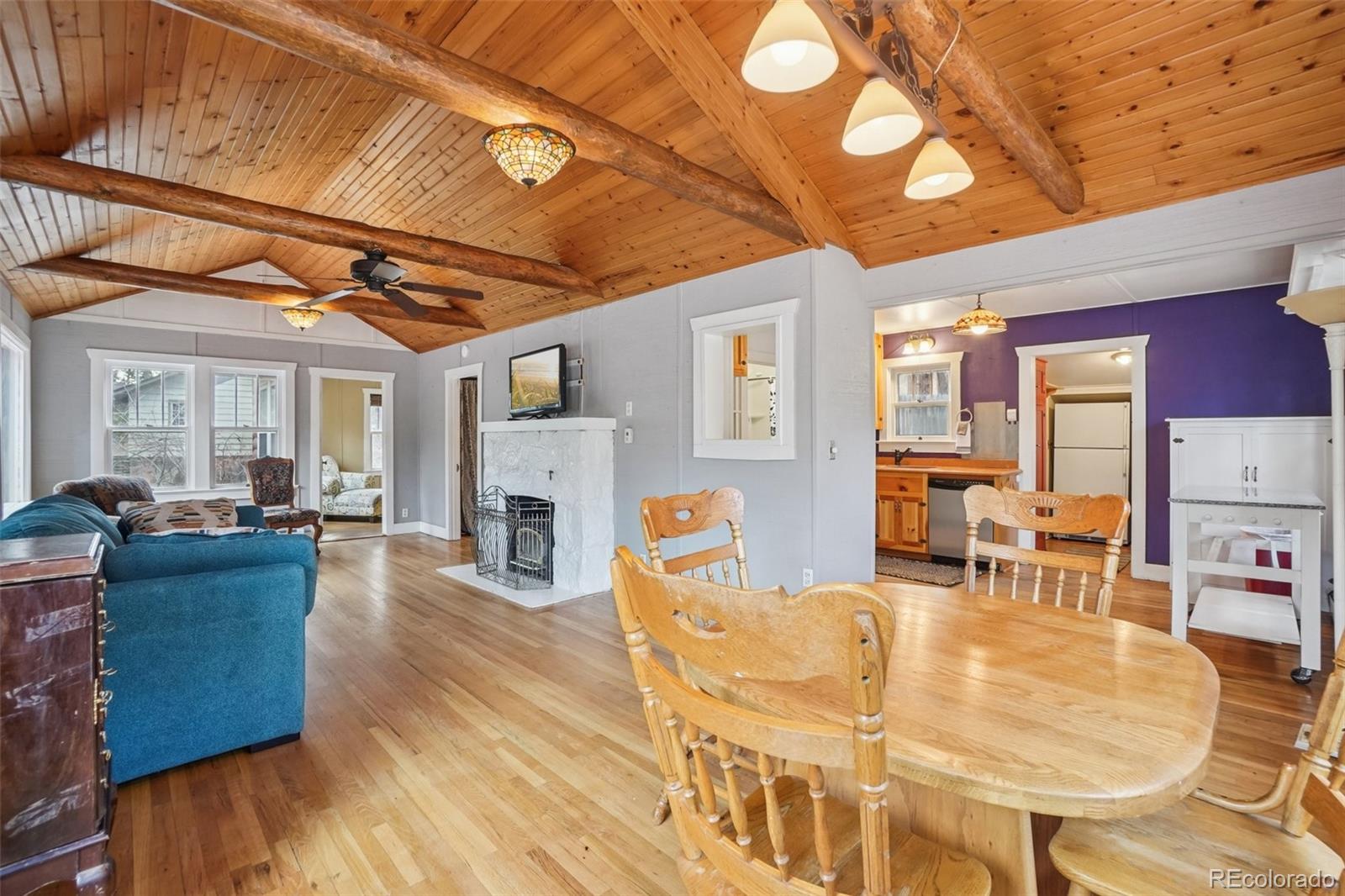 9025 Picabo Road Cascade, CO 80809 - Photo 8 of 44 a living room with furniture and a fireplace